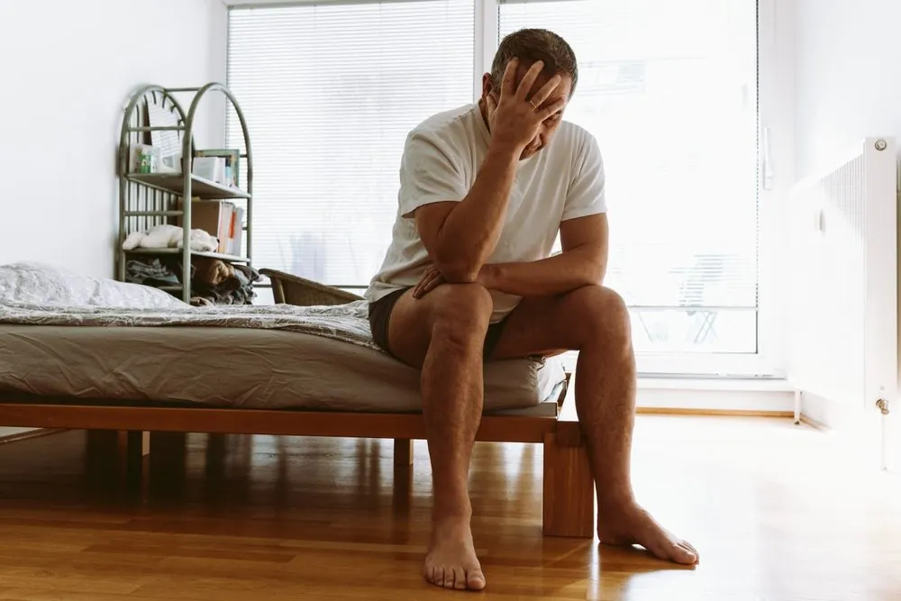 concept of life-weary, suffering, sick man. middle-aged man suffering from insomnia, depression