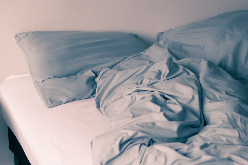 empty disheveled bed